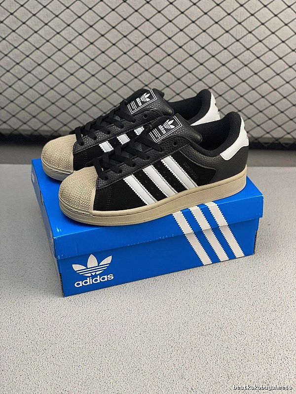 Adidas Black and Cream Shell-Toe Sneakers Highlighting Two-Tone Trim